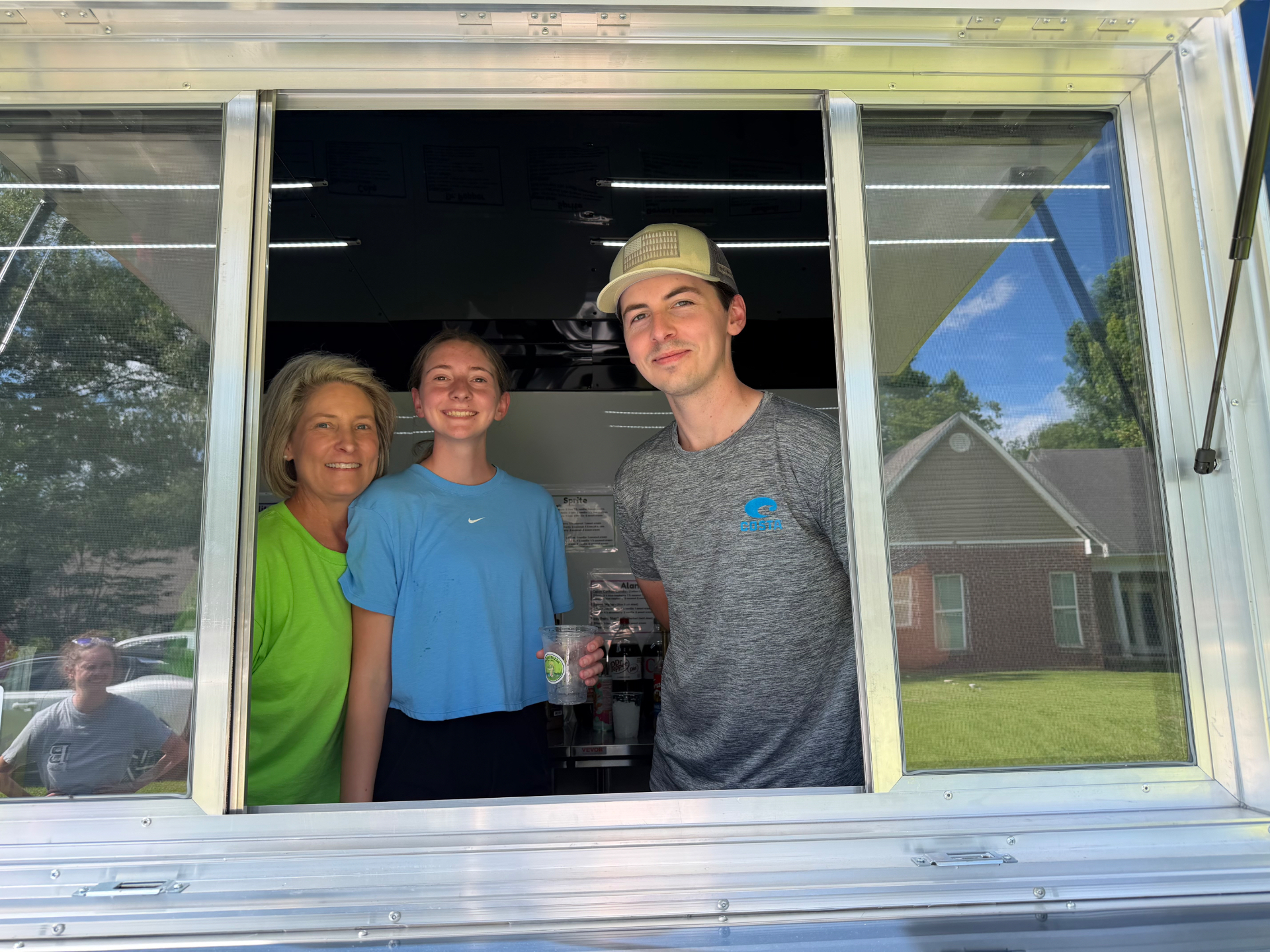 The Bayou Bubba family at the trailer service window